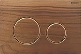 Geberit Sigma50 plaque de déclenchement, design anneaux or rouge brossé sur fond bois Noyer américain.