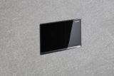 Bouton encastré mural en verre noir Geberit Sigma60.