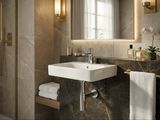 Lavabo mural carré Geberit Smyle de 45 cm en céramique blanche avec trou de robinet central et trop-plein visible.
