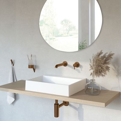 Siphon de lavabo Deante rond en PVD bronze brossé