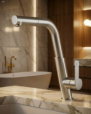 Robinet de cuisine Deante Silia avec finition en acier inoxydable brossé et douchette extractible sur comptoir en marbre.