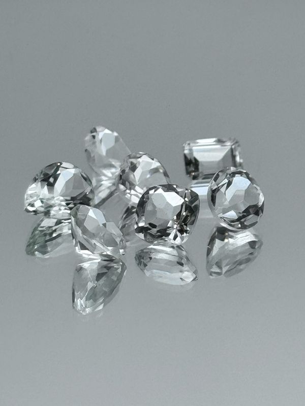 Natural Faceted Clear Quartz, Mixed Lot, Minimum 10 Carat Total Weight, Mixed Shapes And Sizes, Minimum 8 Stones Per Parcel, Stones Clean To Slightly Included. No Two Are Exactly The Same