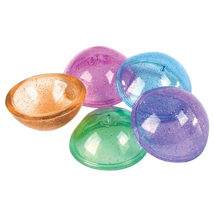 An assortment of differently colored rubber popper toys.