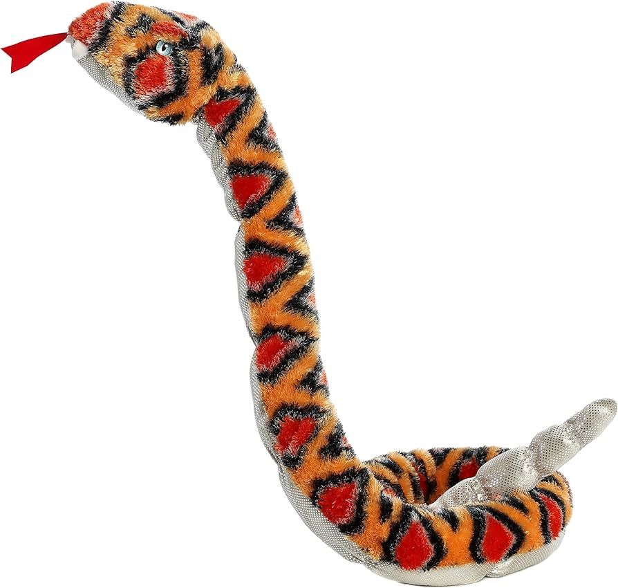 A rattle snake with bright orange and black diamond designs and a rattling tail.