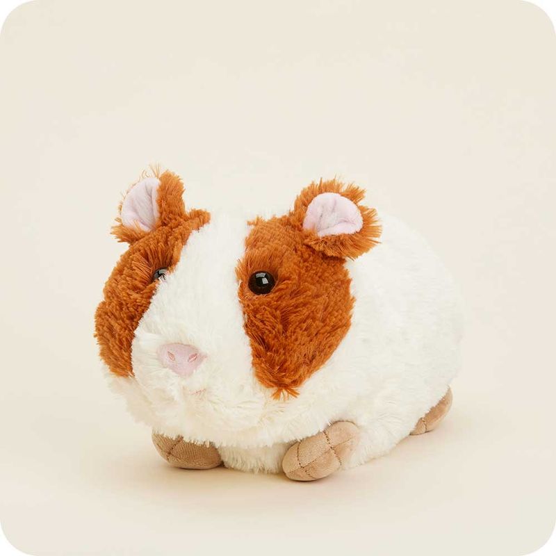 A cute round orange and white guinea pig warmie.