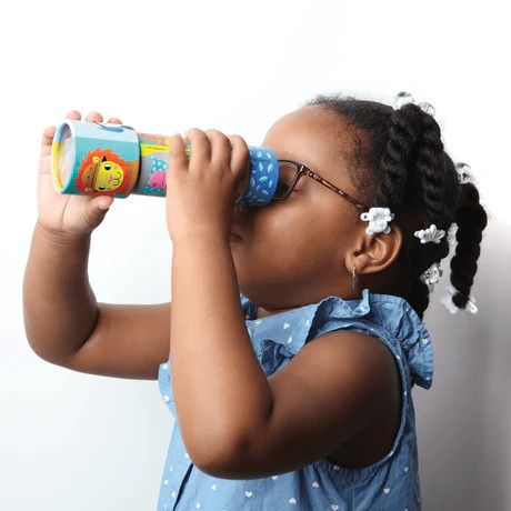 A small child looking through an animal themed kaleidoscope.
