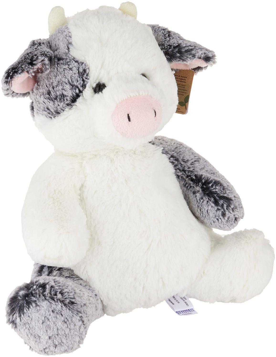 A cute fluffy cow in a sitting position.