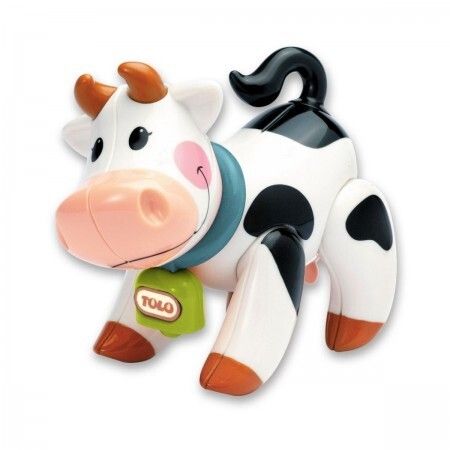 A spotted cow with a cute happy face made out of recycled wheat plastic.