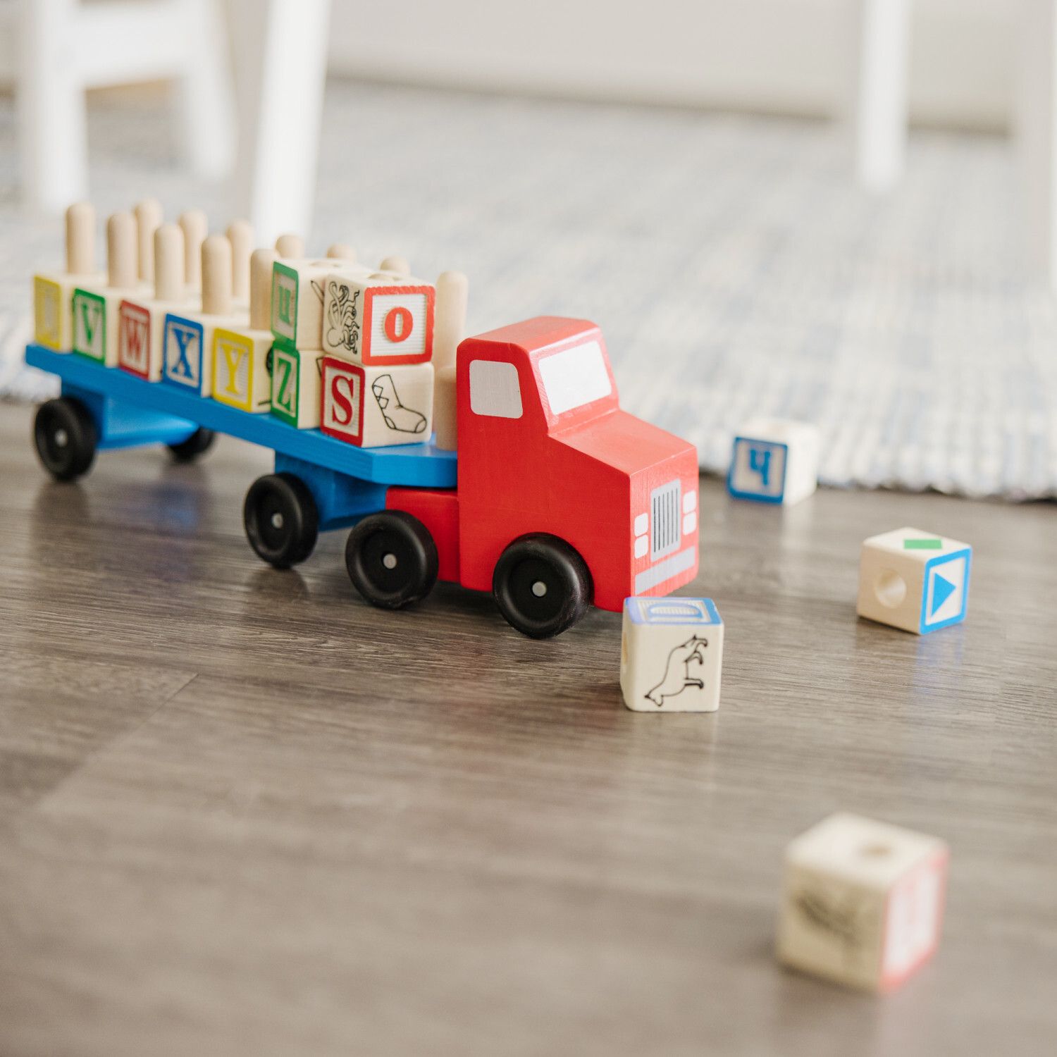 A bright and colorful Melissa and Doug alphabet truck.