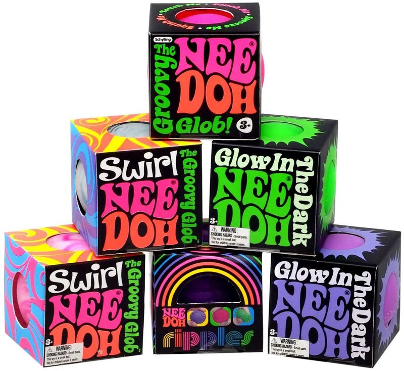 A variety of teenie nee doh singles, including the groovy, glow in the dark, ripples and swirl nee dohs.