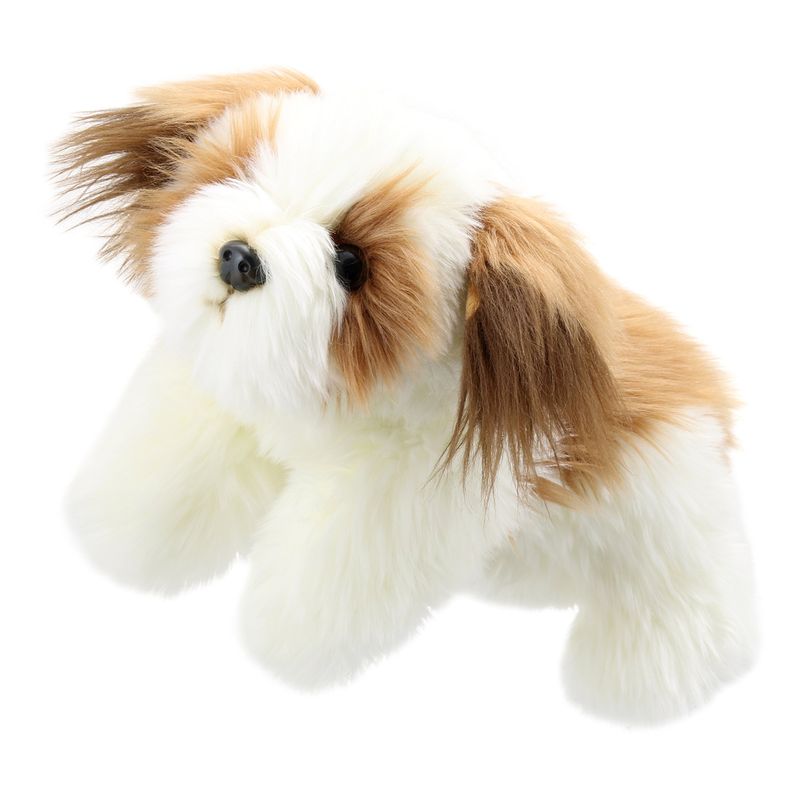 A cute little brown and white dog puppet with fluffy fur.