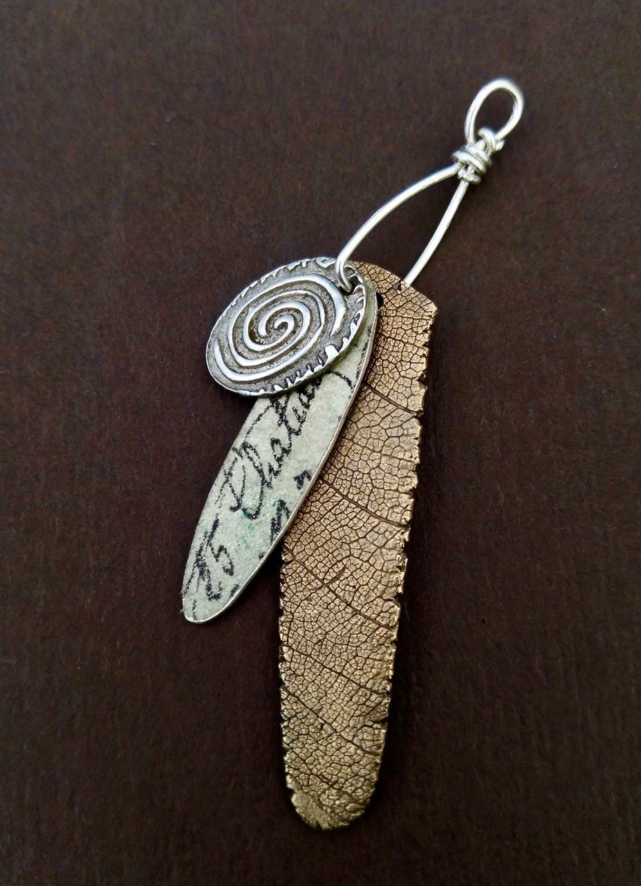 LAYERED AMULETS: BRONZE AND SILVER