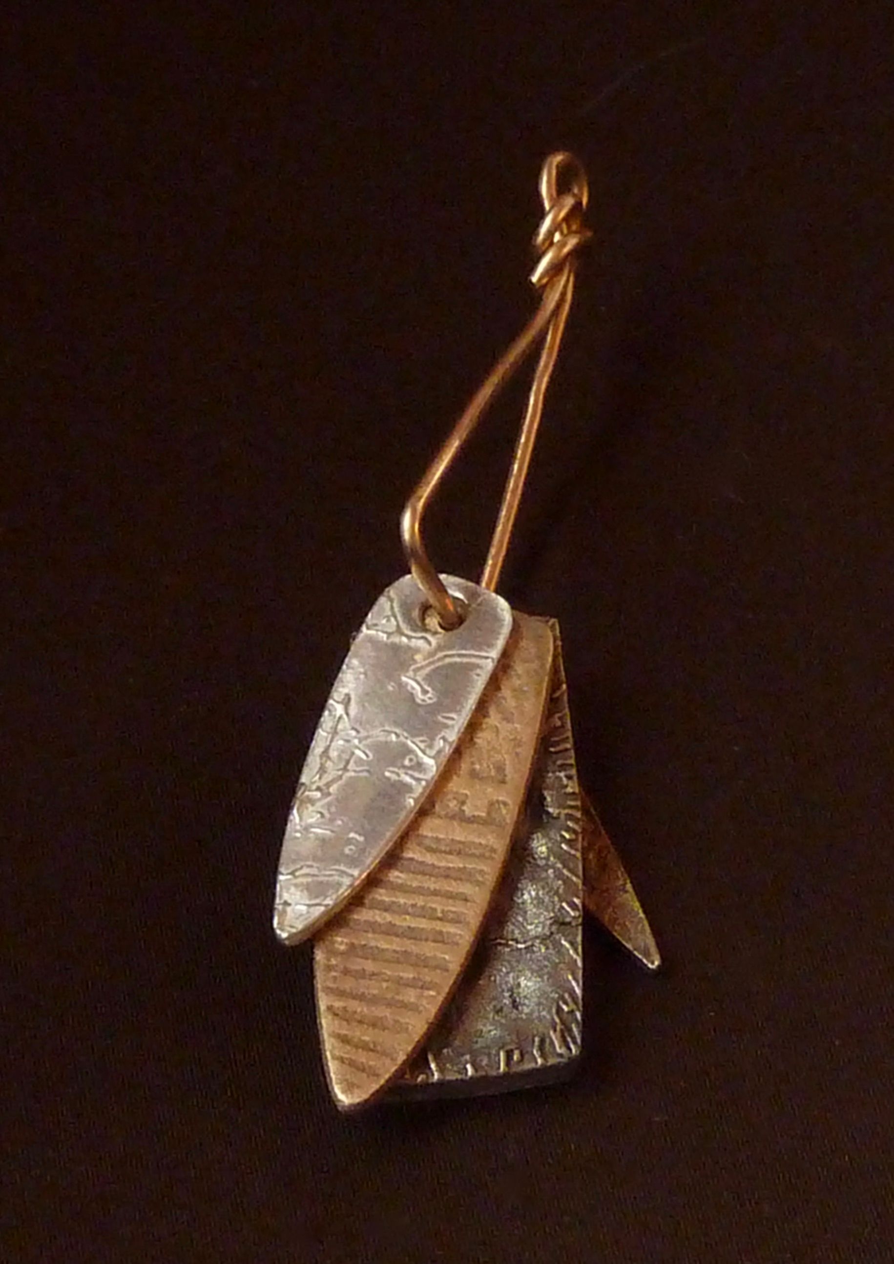 LAYERED AMULETS: BRONZE AND SILVER