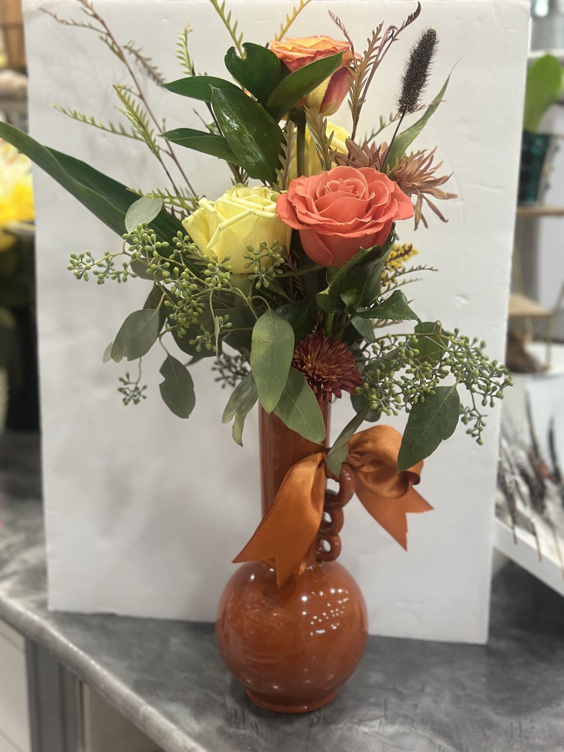 CERAMIC ORANGE BUD VASE WITH HANDLE