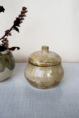 Small golden mushroom canister