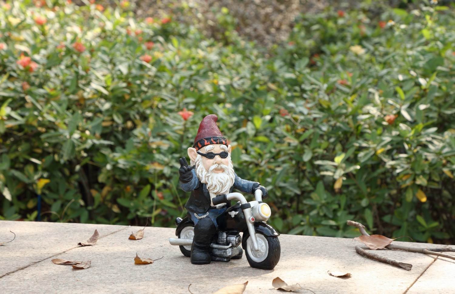 75616-W - GNOME W/PEACE SIGN RIDING MOTORCYCLE  / 9.25&quot; H