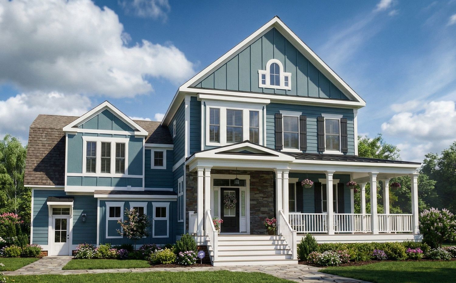 Front exterior view of a two-story blue house with white trim, covered porch, and gabled rooflines.