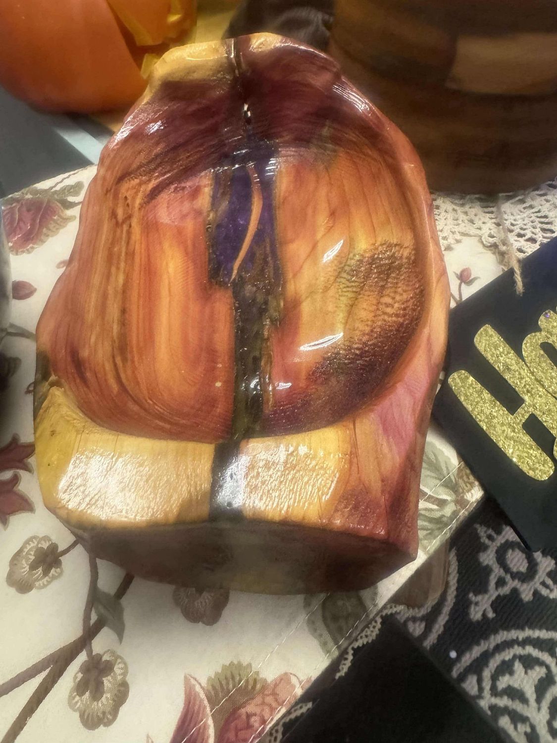 Dark boat shaped wooden bowl w/green