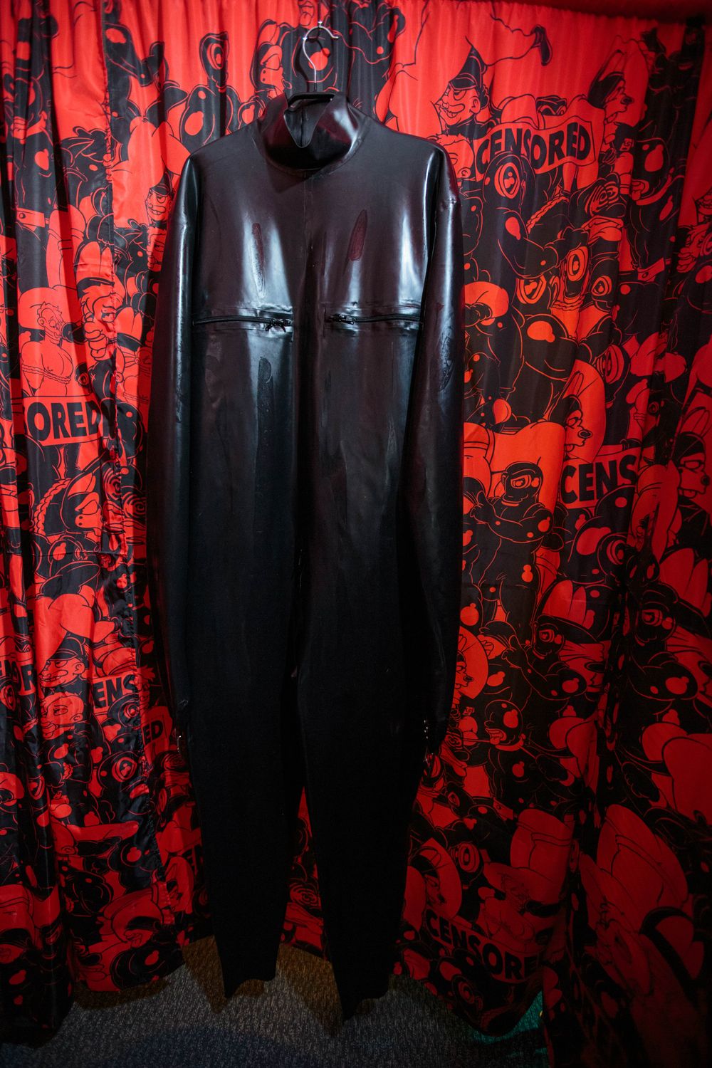 Black latex catsuit with enclosed sleeves