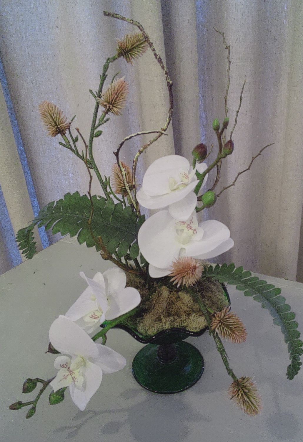 Sm Orchid in green glass