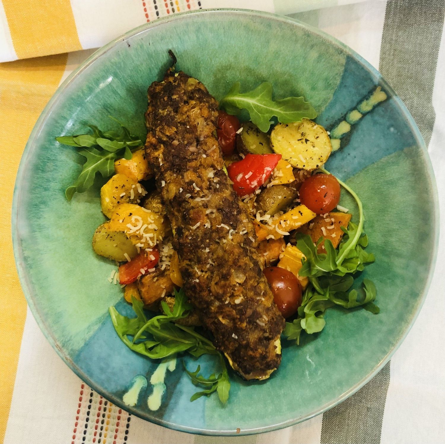 Courgettes farcies sur légumes grillés