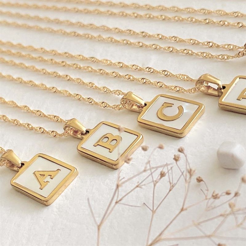 "Carrie" Alphabet Charm Necklace in Gold