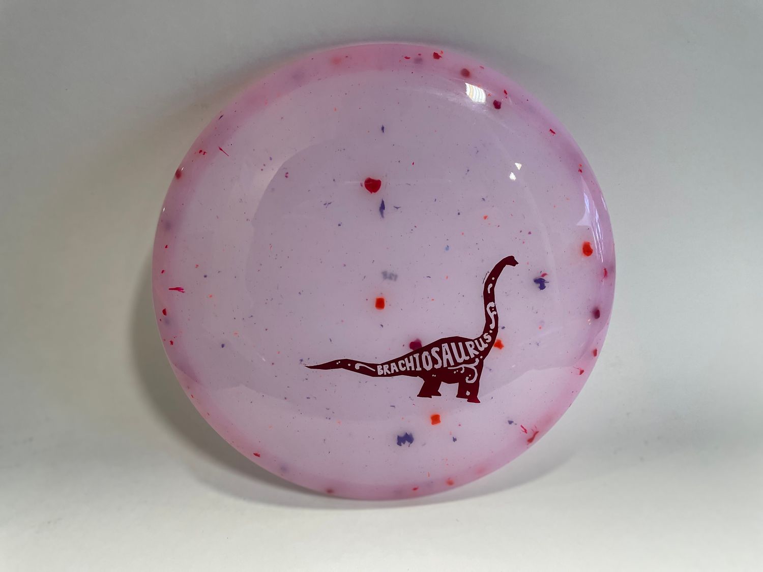 DINO DISCS BRACHIOSAURUS , Plastic: VOLCANIC, Color: PNK