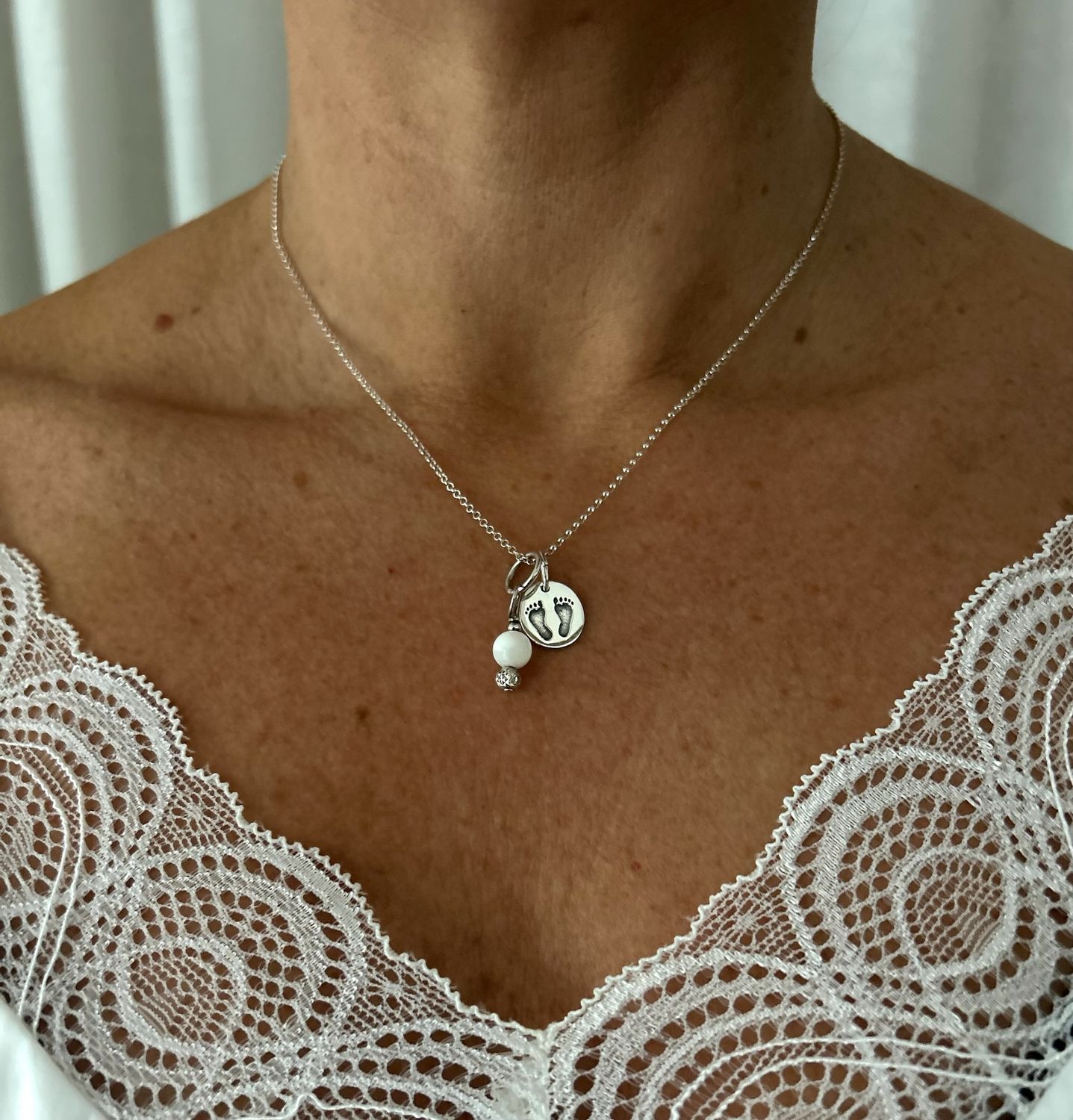 Silver baby feet charm necklace