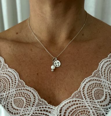 Silver baby feet charm necklace