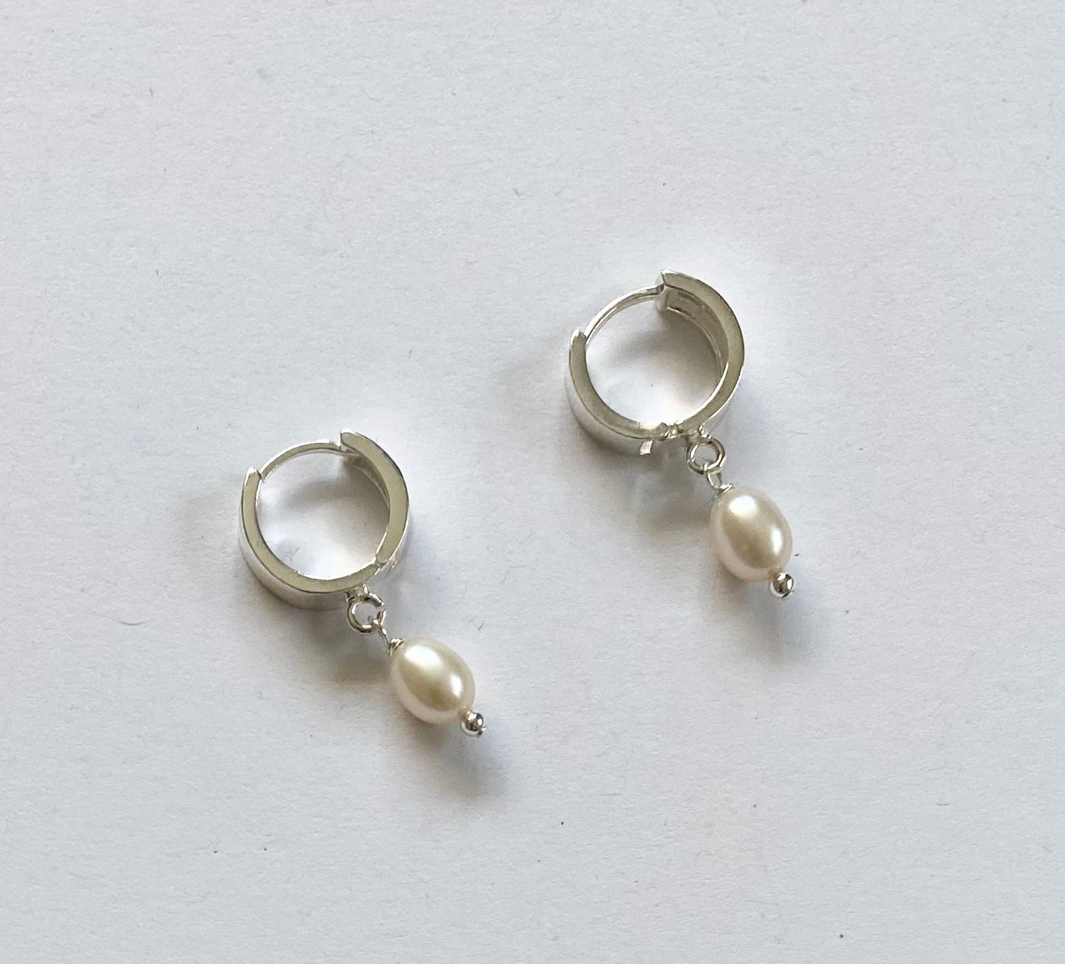 Silver wide huggie pearl hoop earrings