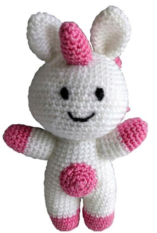 A white and pink crocheted unicorn toy.
