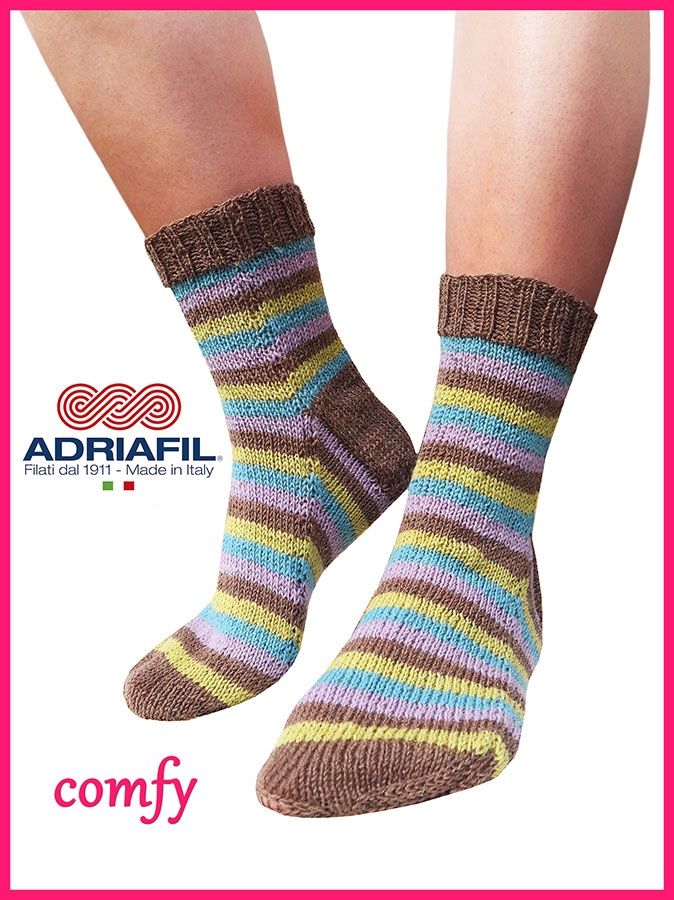 A pair of knitted socks in brown, blue, purple and green stripes.