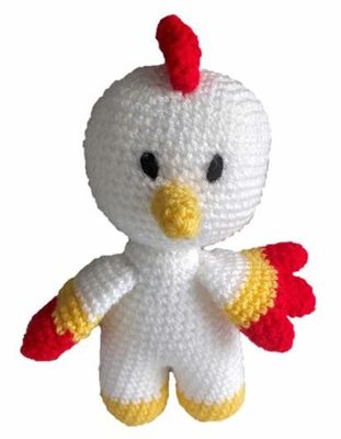 A white, yellow and red crocheted chicken toy.