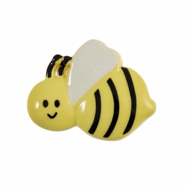 A yellow, black and white bee shaped button.