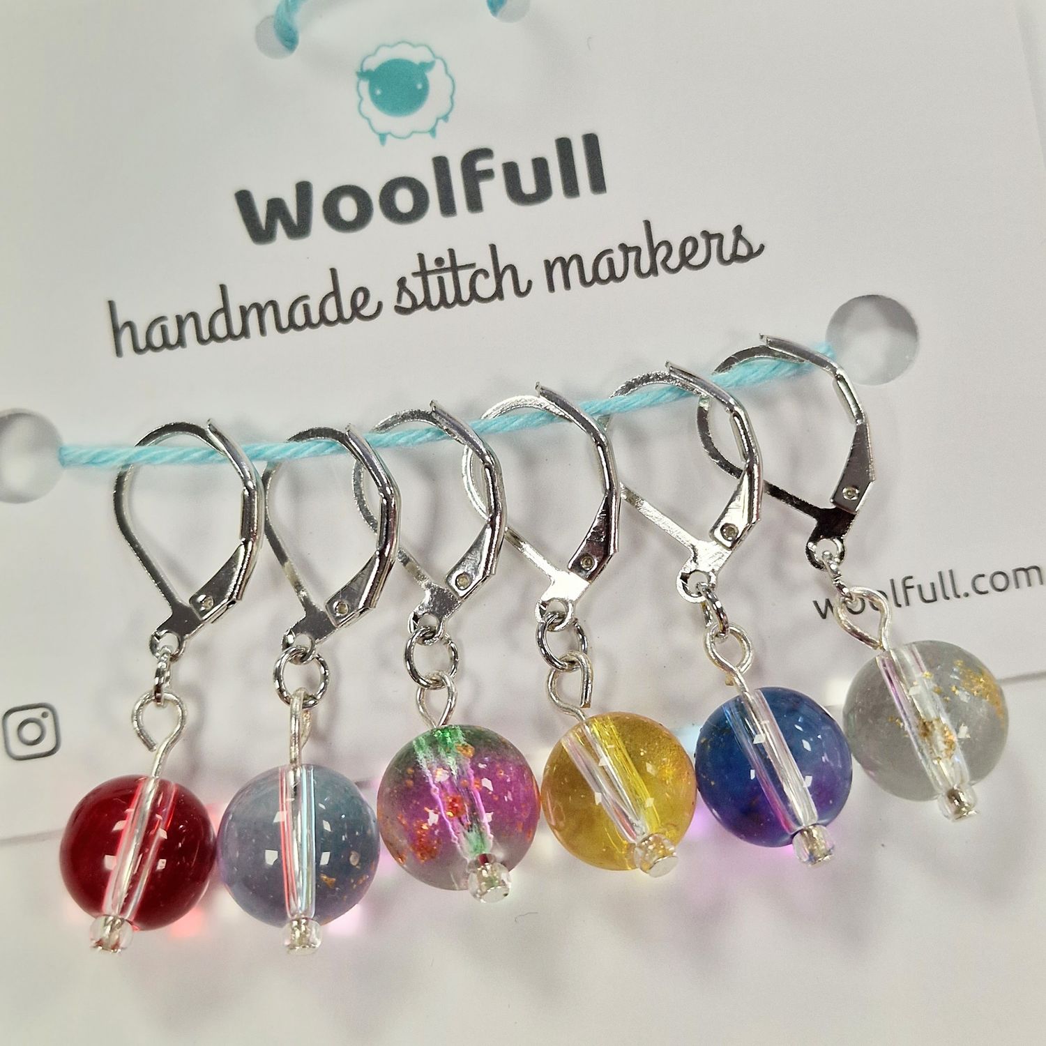 6 rainbow glass bead stitch markers.