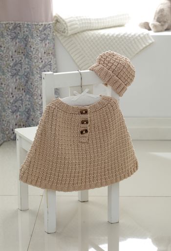 A pale brown knitted poncho and hat.