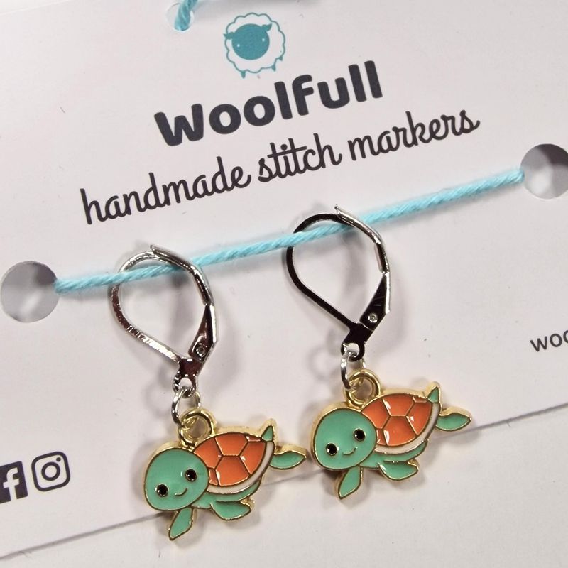 2 turtle shaped stitch markers.