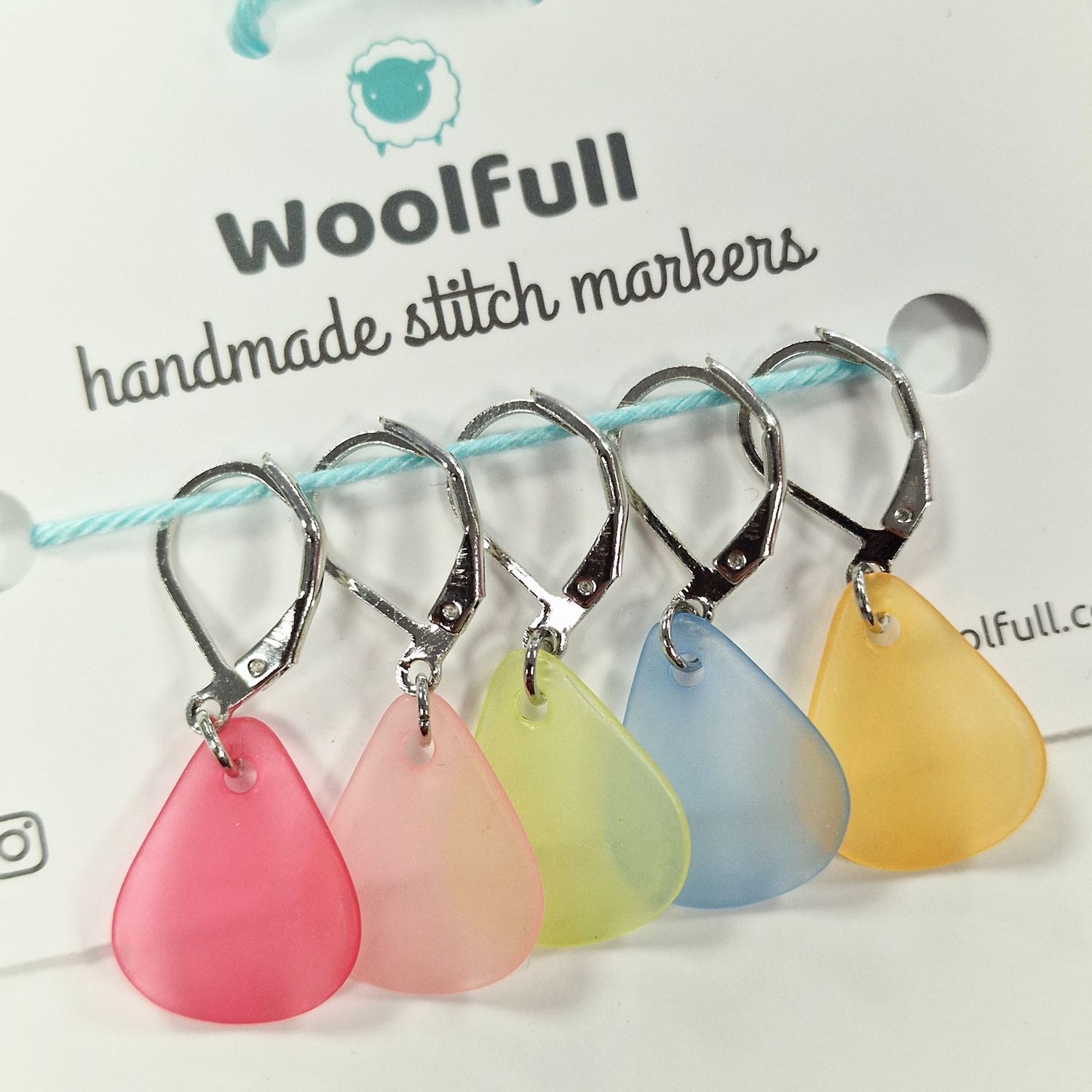 5 pastel petal shaped stitch markers.