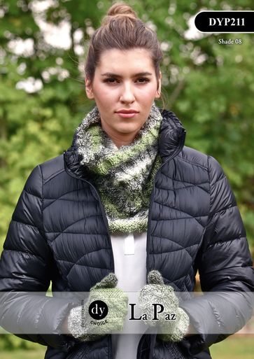 A woman is wearing a knitted cowl and mitts, both in a variegated green yarn.
