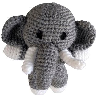 A grey and white crocheted elephant toy.