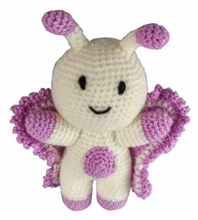A cream and purple crocheted butterfly toy.