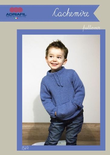 A boy is wearing a dark blue knitted sweater.