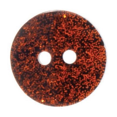 A round glittery orange button.