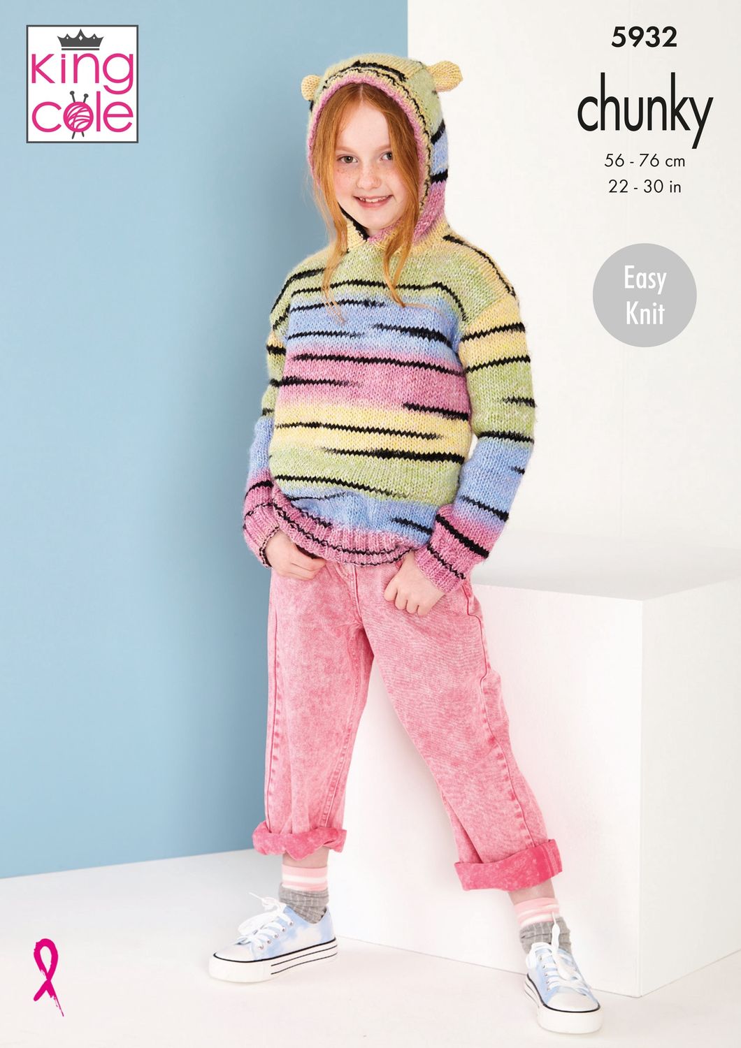 A girl is wearing a variegated knitted hoodie in shades of yellow, pink, blue and green with random thin black stripes throughout.