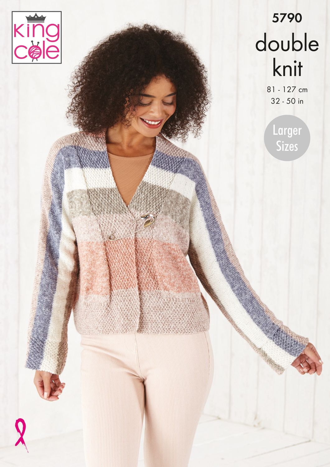 A woman is wearing a knitted cardigan in peach, cream, beige and blue stripes.