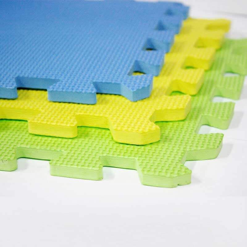 3 blocking mats - 1 blue, 1 yellow and 1 green stacked up on a white background. 
