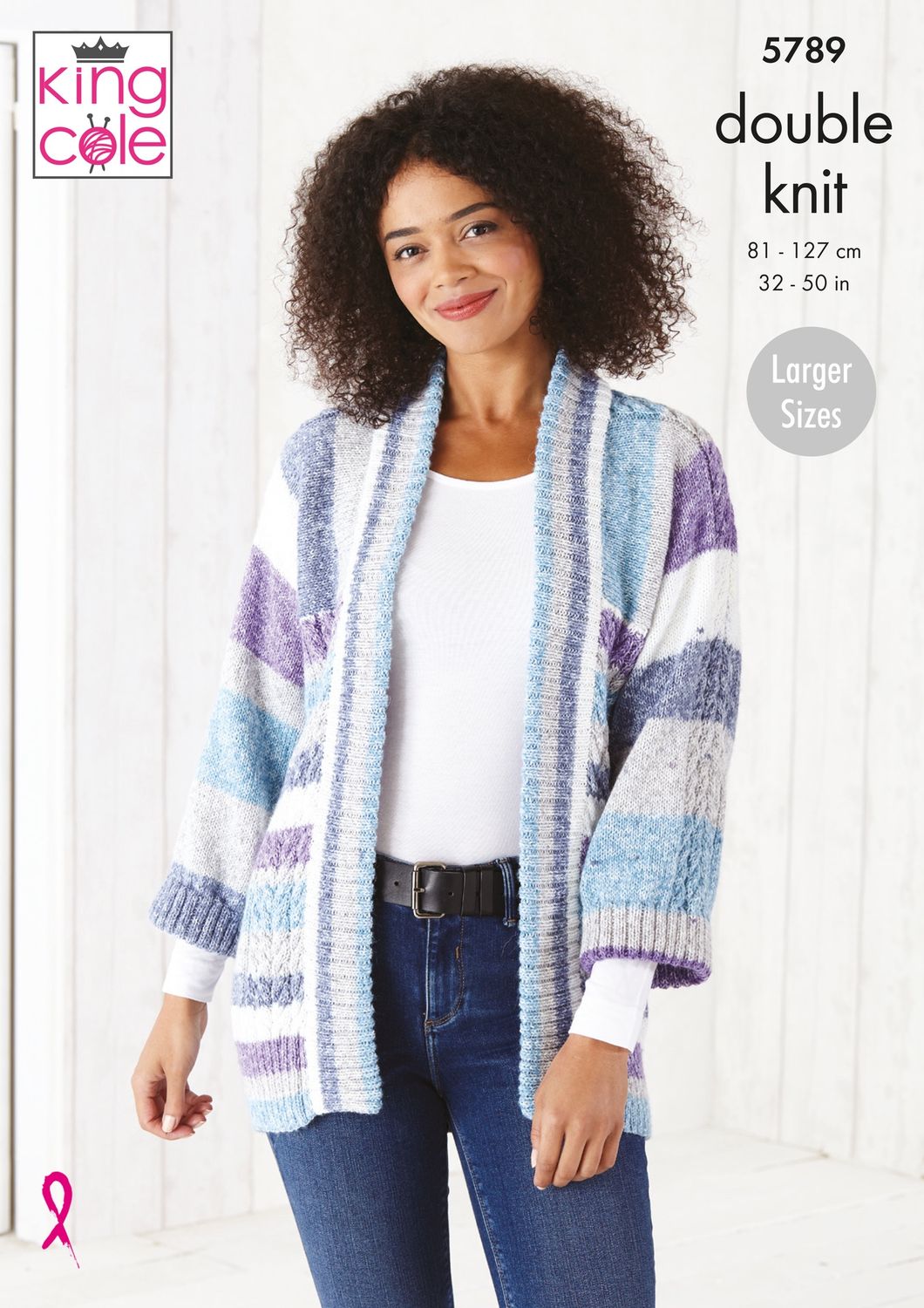 A woman is wearing a knitted cardigan in purple, blue and cream stripes.