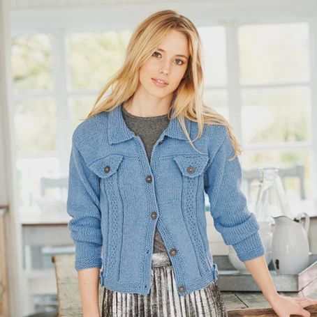 A woman is wearing a denim blue knitted jacket.