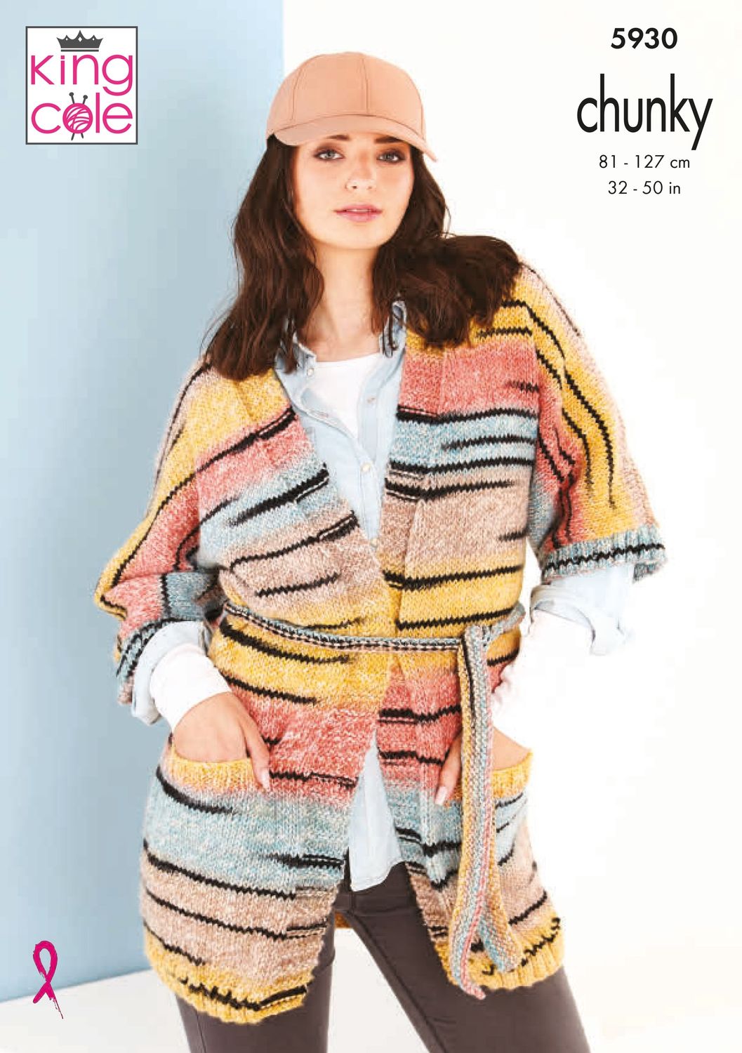 A woman is wearing a variegated knitted cardigan in shades of yellow, red, brown and blue with random thin black stripes throughout.