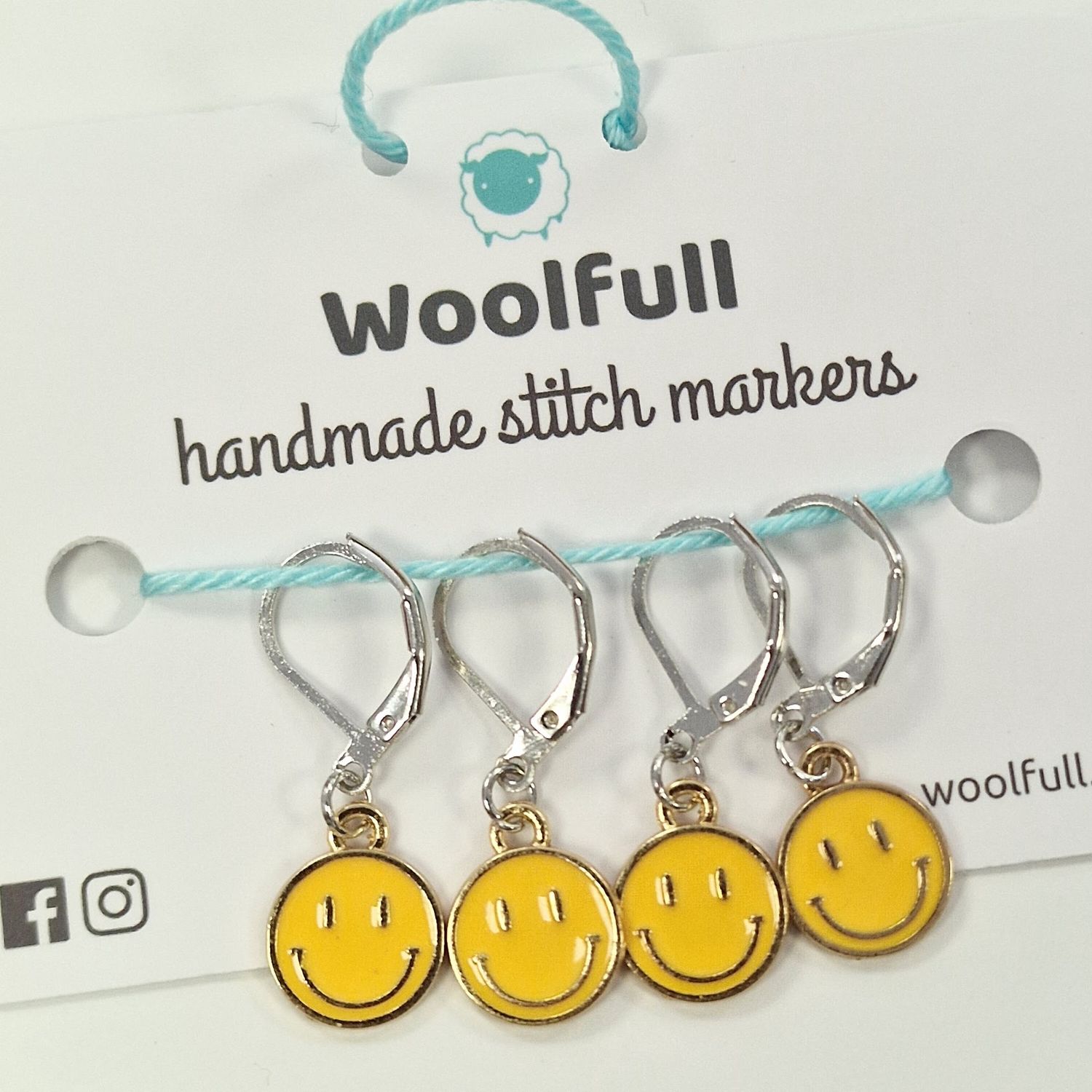 4 yellow smiley face stitch markers.